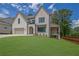 Charming two-story house with a manicured lawn, attractive brickwork, and a cozy front porch at 380 Hillcrest View Dr, Suwanee, GA 30024