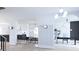 Bright foyer with modern lighting, hardwood floors, arched openings to dining, kitchen and office at 380 Hillcrest View Dr, Suwanee, GA 30024