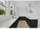 Modern kitchen featuring quartz countertops, black cabinetry, and stainless steel appliances at 380 Hillcrest View Dr, Suwanee, GA 30024