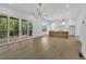 Open concept floor plan kitchen and living room with access to deck at 380 Hillcrest View Dr, Suwanee, GA 30024