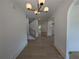 Bright open-concept space with hardwood floors, recessed lighting, and an archway at 380 Hillcrest View Dr, Suwanee, GA 30024