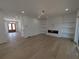 Living room with fireplace, built in shelving and glass doors to outside at 380 Hillcrest View Dr, Suwanee, GA 30024