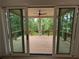 View of an outdoor deck from inside the home with a ceiling fan at 380 Hillcrest View Dr, Suwanee, GA 30024