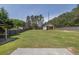 Wide view of the backyard with storage shed, and lots of space for outdoor living at 1635 Round Rd, Grayson, GA 30017