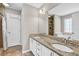 Bathroom featuring a double sink vanity with granite countertops and tiled floors at 1635 Round Rd, Grayson, GA 30017