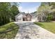 Charming single-Gathering home features a well-manicured lawn and a long driveway at 1635 Round Rd, Grayson, GA 30017