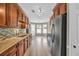 Bright eat-in kitchen showcases a bay window, stainless appliances, granite counters and plenty of storage at 1635 Round Rd, Grayson, GA 30017