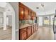 Open kitchen with stainless steel appliances, granite countertops and stylish mosaic backsplash at 1635 Round Rd, Grayson, GA 30017