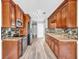 Kitchen featuring stainless steel appliances, granite countertops, and wood cabinets at 1635 Round Rd, Grayson, GA 30017