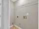 Laundry room with tiled floors and a wire rack shelf at 1635 Round Rd, Grayson, GA 30017