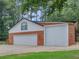 Large detached garage with two garage doors and ample parking space at 219 Riverbrook Ct, Mcdonough, GA 30252