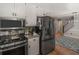 Modern kitchen with stainless steel appliances and hardwood floors at 219 Riverbrook Ct, Mcdonough, GA 30252