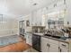 Charming kitchen with light cabinetry, stainless steel appliances, and a view of the outdoors at 219 Riverbrook Ct, Mcdonough, GA 30252