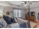 Comfortable main bedroom boasting hardwood flooring, tray ceilings, and stylish furnishings at 219 Riverbrook Ct, Mcdonough, GA 30252