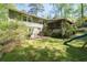 Spacious backyard with a stone patio for outdoor dining and entertaining at 380 Amberidge Trl, Atlanta, GA 30328