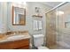 Bathroom featuring glass shower, granite countertop, and classic fixtures at 380 Amberidge Trl, Atlanta, GA 30328