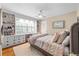 Comfortable bedroom with built-ins, plantation shutters, and soft, cozy bedding at 380 Amberidge Trl, Atlanta, GA 30328