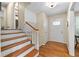 Light-filled foyer with hardwood floors, a white front door, and access to the upper level at 380 Amberidge Trl, Atlanta, GA 30328