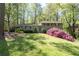Charming home with a well-manicured lawn and colorful azalea bushes at 380 Amberidge Trl, Atlanta, GA 30328