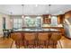 Open-concept kitchen featuring a center island with seating and modern pendant lighting at 380 Amberidge Trl, Atlanta, GA 30328