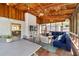 Relaxing screened porch featuring wood ceiling, brick accent wall and comfortable seating areas at 380 Amberidge Trl, Atlanta, GA 30328