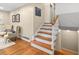 Beautiful staircase with hardwood steps and white banister, leading to the upper level at 380 Amberidge Trl, Atlanta, GA 30328