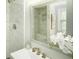 A bathroom vanity with marble tiles and a shower at 104 Holcomb Ferry Rd, Roswell, GA 30076