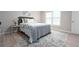 Cozy bedroom with a comfortable bed, soft linens, and bright natural light at 104 Holcomb Ferry Rd, Roswell, GA 30076