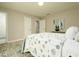 A bedroom with a plush bed and a vibrant rug at 104 Holcomb Ferry Rd, Roswell, GA 30076