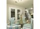 Elegant dining space with glass table, stylish chairs, and open kitchen view at 104 Holcomb Ferry Rd, Roswell, GA 30076