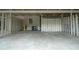 Spacious garage with concrete flooring and ample room for vehicles at 104 Holcomb Ferry Rd, Roswell, GA 30076