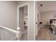 A hallway leading to a bedroom with hardwood floors at 104 Holcomb Ferry Rd, Roswell, GA 30076