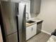 Kitchen with stainless steel appliances, tile flooring, and granite countertops at 104 Holcomb Ferry Rd, Roswell, GA 30076