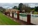 Inviting community pool area with a well-maintained lawn and fencing at 104 Holcomb Ferry Rd, Roswell, GA 30076