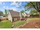 Beautiful backyard with outdoor patio furniture, fire pit and green lawn at 272 William Nye Se Dr, Atlanta, GA 30315