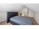 Bedroom with black headboard and dormer ceiling at 272 William Nye Se Dr, Atlanta, GA 30315