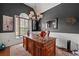 Elegant home office featuring a large wooden desk, high ceilings, and sophisticated decor at 272 William Nye Se Dr, Atlanta, GA 30315