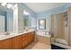 Spacious main bathroom featuring double vanity, soaking tub, separate shower, and ample storage at 272 William Nye Se Dr, Atlanta, GA 30315