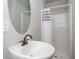 Modern bathroom featuring new fixtures and a shower with decorative curtain at 605 Rocky Branch Rd, Villa Rica, GA 30180