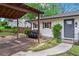 Well-kept home with covered carport, brick accents, and inviting entrance at 605 Rocky Branch Rd, Villa Rica, GA 30180