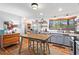Bright, renovated kitchen with stainless appliances and center table at 605 Rocky Branch Rd, Villa Rica, GA 30180