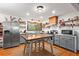 Renovated kitchen featuring stainless appliances and stylish open shelving at 605 Rocky Branch Rd, Villa Rica, GA 30180