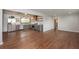Open concept kitchen with gray cabinets, stainless steel appliances, and wood floating shelves at 605 Rocky Branch Rd, Villa Rica, GA 30180