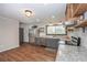 Beautiful kitchen features stainless steel appliances, granite counters, and floating shelves at 605 Rocky Branch Rd, Villa Rica, GA 30180