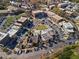 This aerial shows a vibrant town center with shops, offices, and ample parking for visitors and residents at 7515 Cordery Rd, Cumming, GA 30040