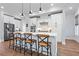 Bright kitchen featuring white cabinets, stainless steel appliances, and hardwood floors at 7515 Cordery Rd, Cumming, GA 30040
