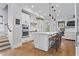 Bright kitchen with a large center island, stainless steel appliances, and hardwood flooring at 7515 Cordery Rd, Cumming, GA 30040