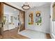 Elegant living room with hardwood floors, a stylish sliding barn door and large windows at 7515 Cordery Rd, Cumming, GA 30040