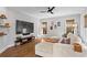 Modern living room with a large TV, cozy sectional sofa, and tasteful decor at 7515 Cordery Rd, Cumming, GA 30040