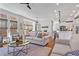 Open-concept living room with hardwood floors, neutral decor, and seamless flow to the kitchen at 7515 Cordery Rd, Cumming, GA 30040